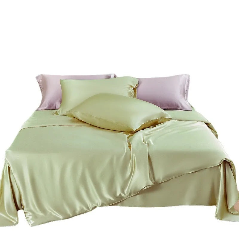 Solid colour silk duvet cover in Lotus Pink showing plain weave texture on a bed.
