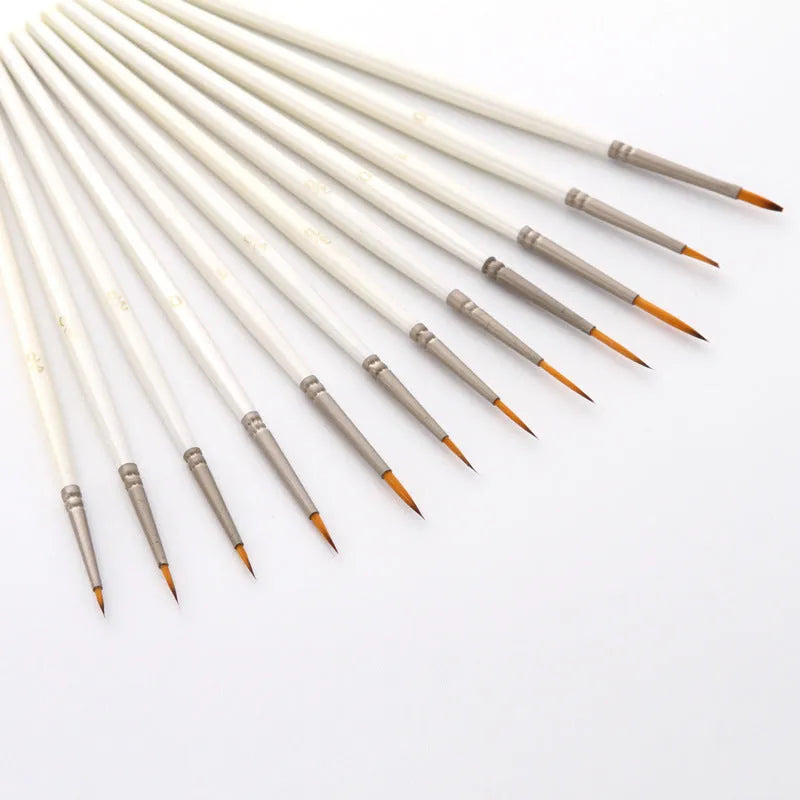 Set of 12 Pearl White handled artist paint brushes with nylon wool heads, sizes 000 to 4/0.