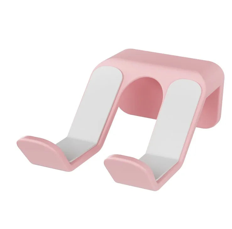Black universal wall hanging rack for game controllers with non-perforated handle and adhesive mount.