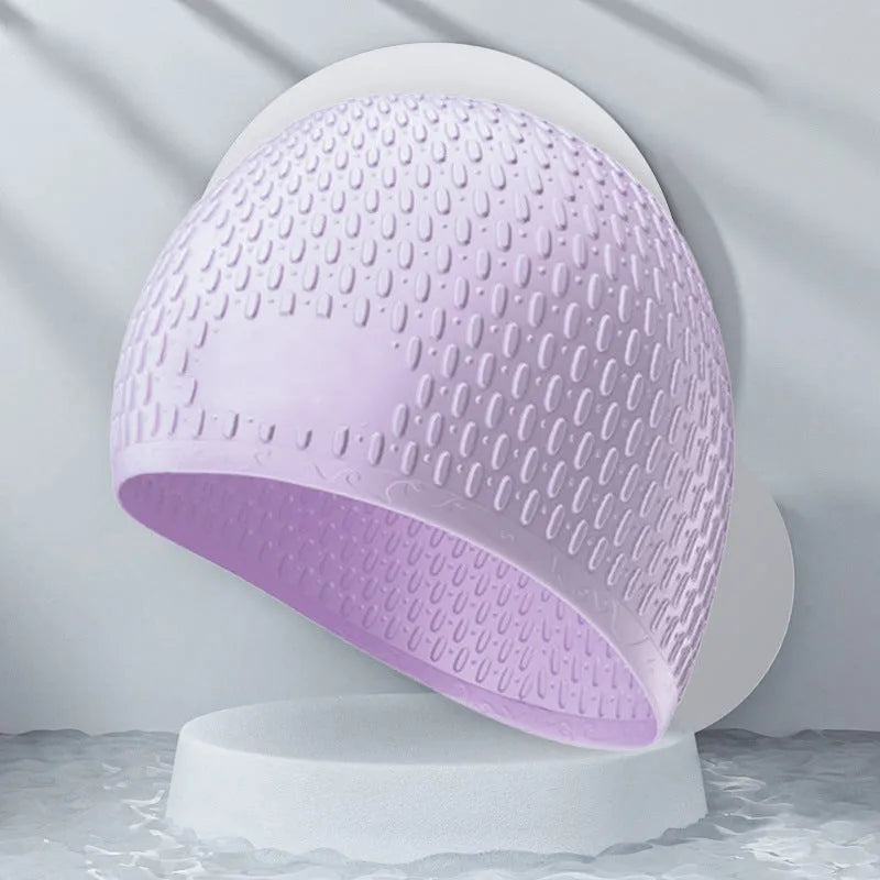 Solid colour silicone swimming cap for adults on white background.