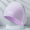Solid colour silicone swimming cap for adults on white background.
