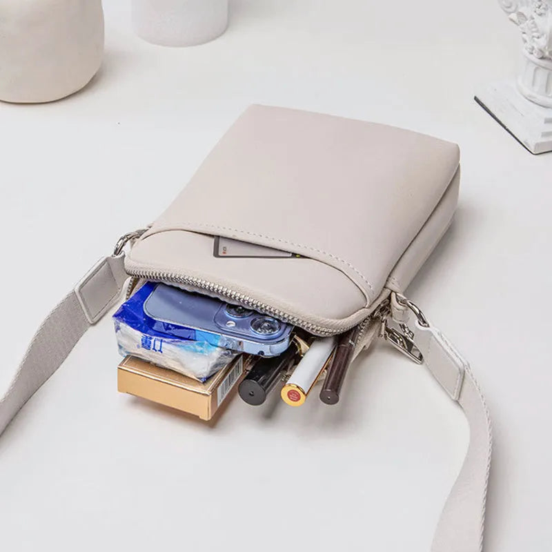 Solid colour PU leather small crossbody phone bag measuring 14.5cm by 5.5cm by 19cm