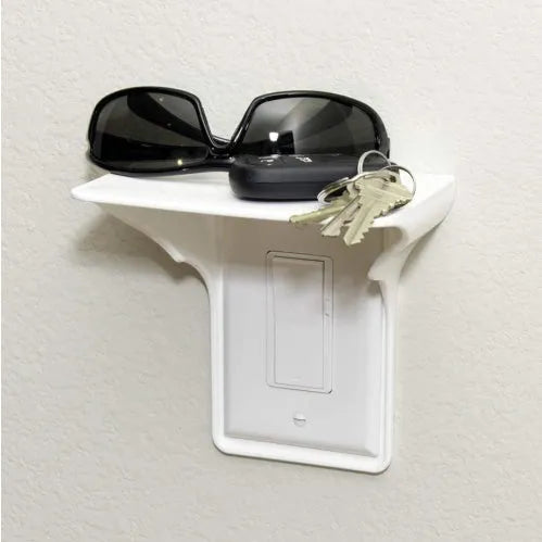 White plastic socket storage rack for tool organisation on a workbench.