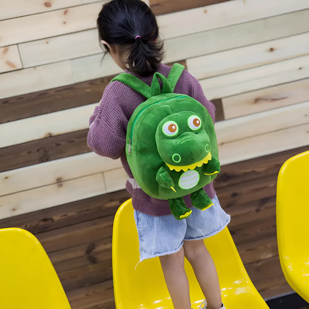 Blue dinosaur plush backpack with embroidery detailing and soft handle for children
