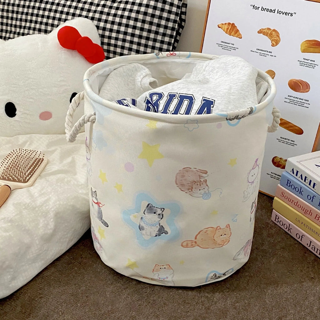 Foldable cotton laundry basket showing one of twelve colour patterns including animal motifs