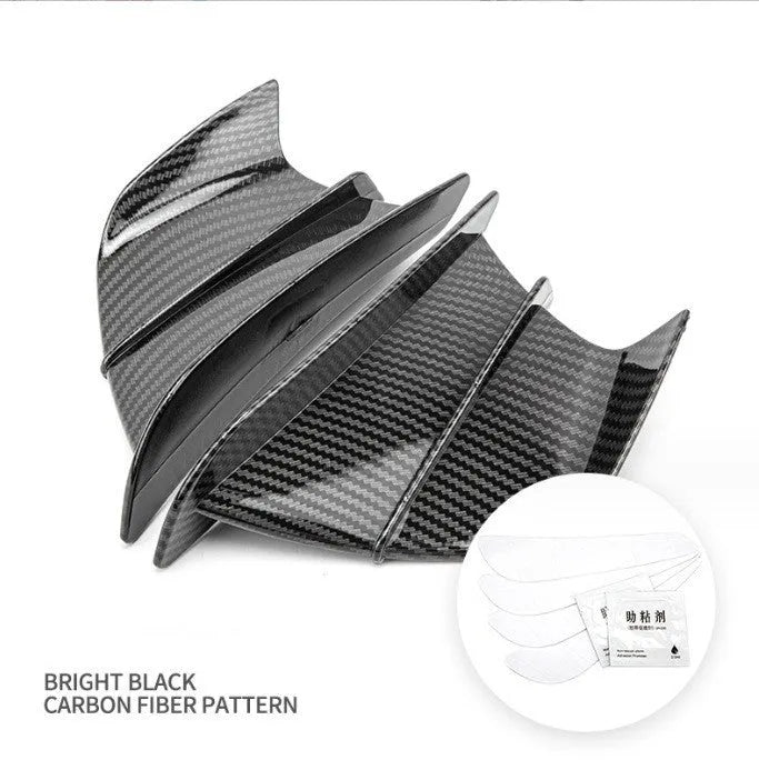 Universal motorcycle spoiler wind wings in pure black finish with glossy forged pattern, side view on a dark background.