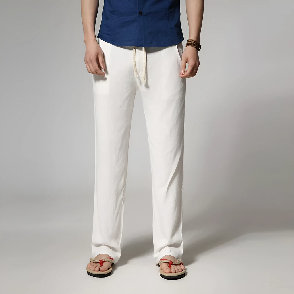 Men's loose straight cotton and linen casual pants in khaki, flat lay, showing zip fly and mid waist detail