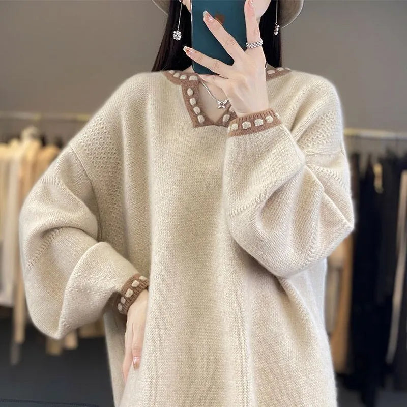 Women's camel coloured V-neck long sleeve viscose pullover sweater on a hanger.