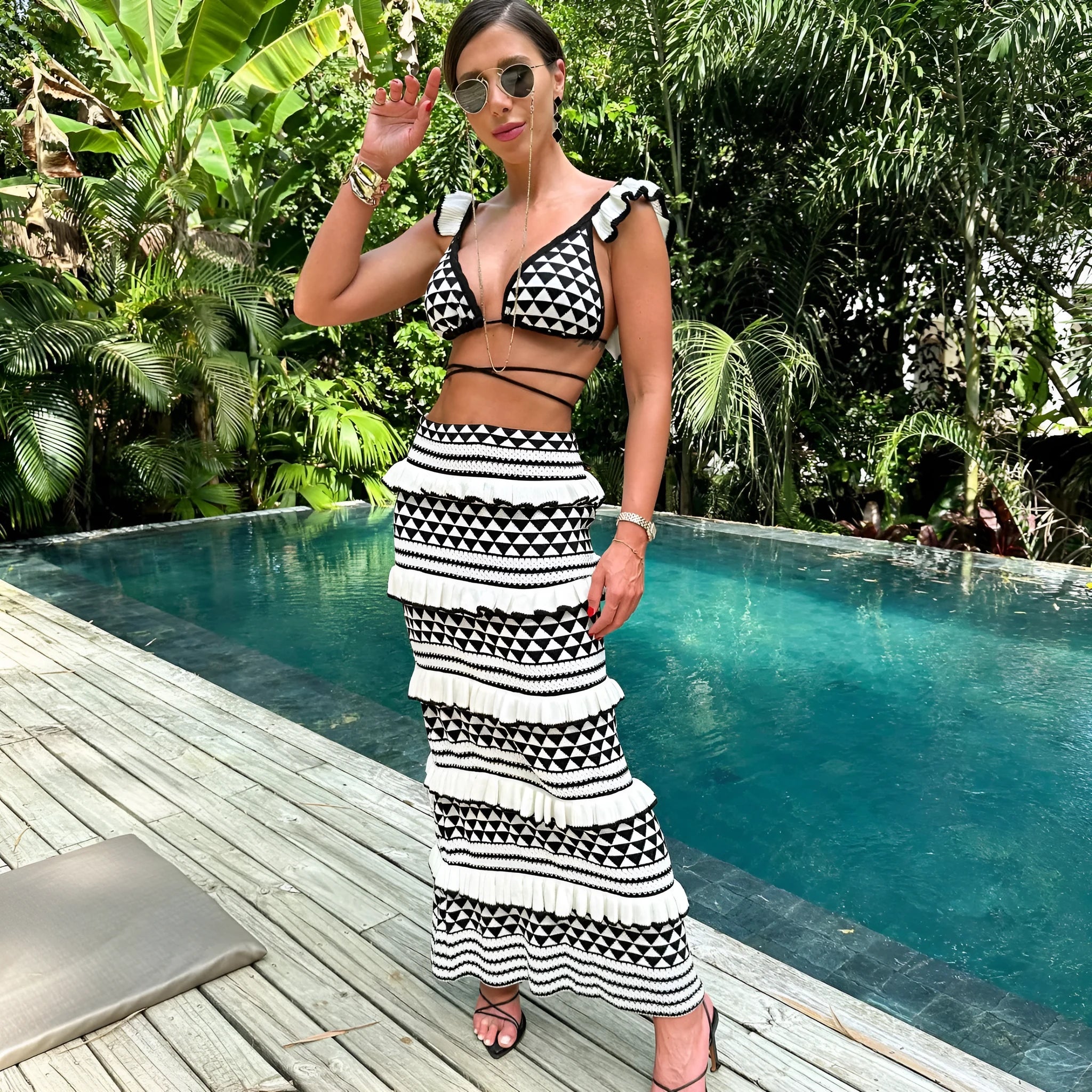 Women's striped bikini set with ruffled spaghetti straps top and long knitted skirt in black and white stripes