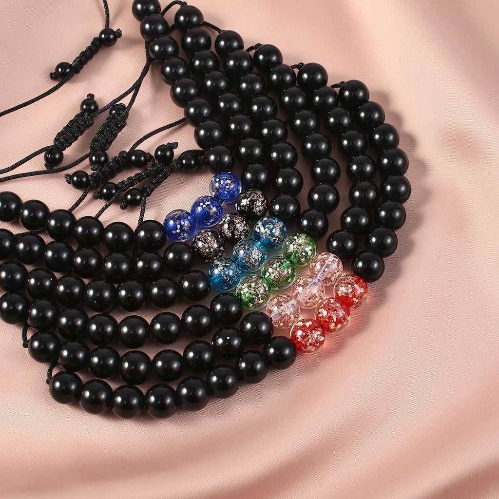 Beaded adjustable luminous bracelet in six colours: black, red, green, pink, blue, sapphire blue, glass or coloured glaze beads, geometric shape