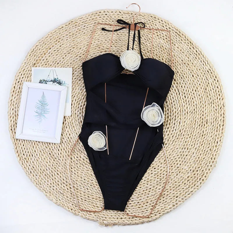 Women's 3D flower one-piece nylon swimsuit available in black and blue stripes, sizes S to XL
