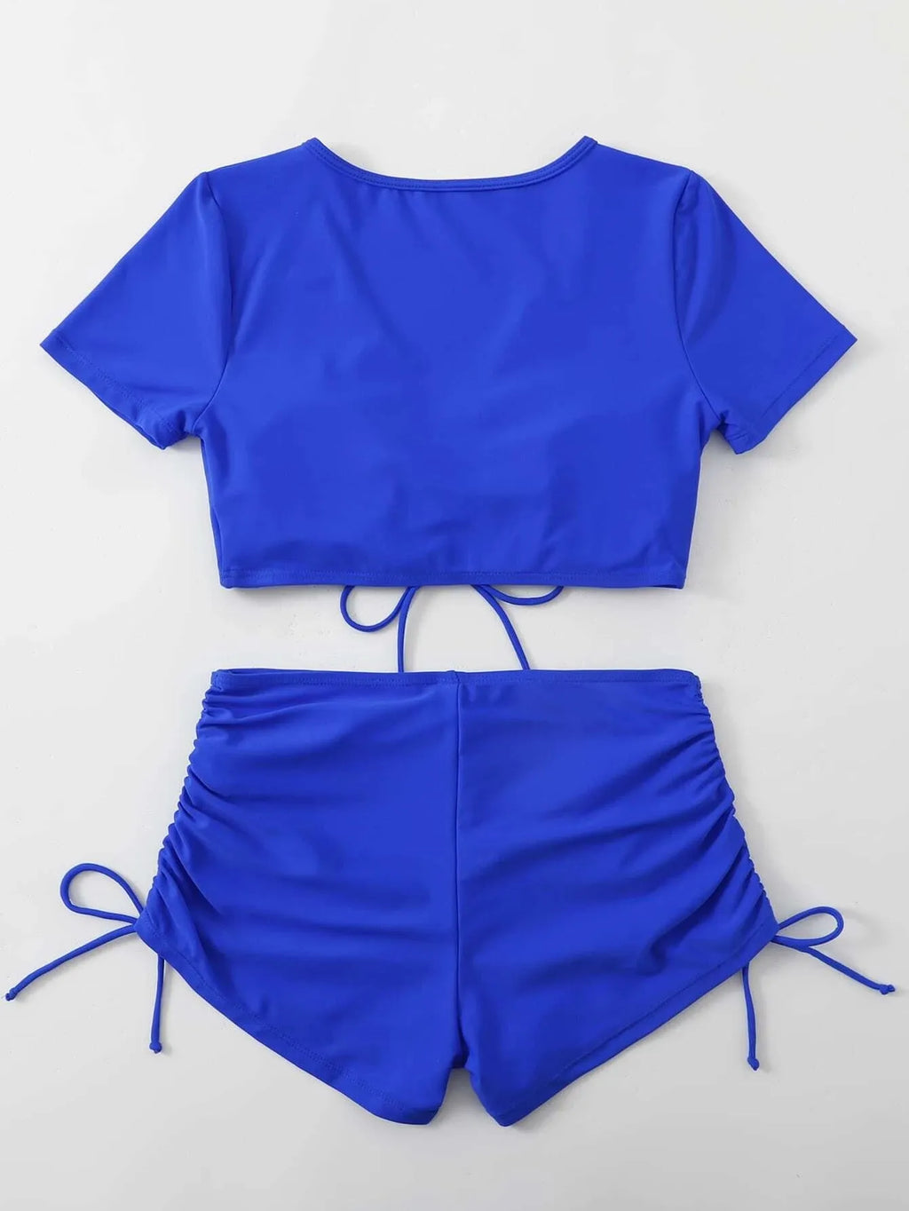 Lady's dark green lace-up bow swimsuit top with matching shorts on a mannequin.