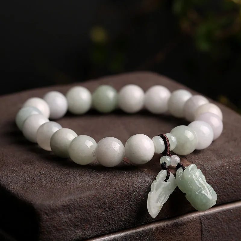Natural jade bracelet with geometric beads showing Maitreya Buddha, double apple, and money bag symbols