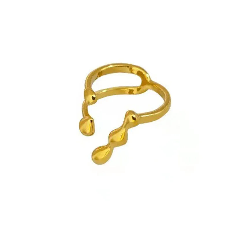 Gold brass opening ring with spherical decorative element on circular band