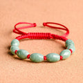 Natural jade bracelet in dark green for men with 9 beads, national style, on display with certificate.