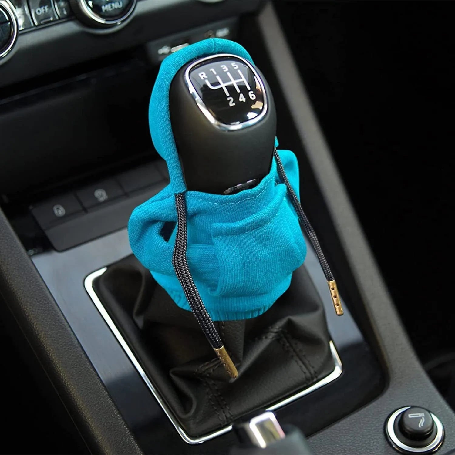 Cloth gear shift knob hoodie cover in various colours on a car gear stick.