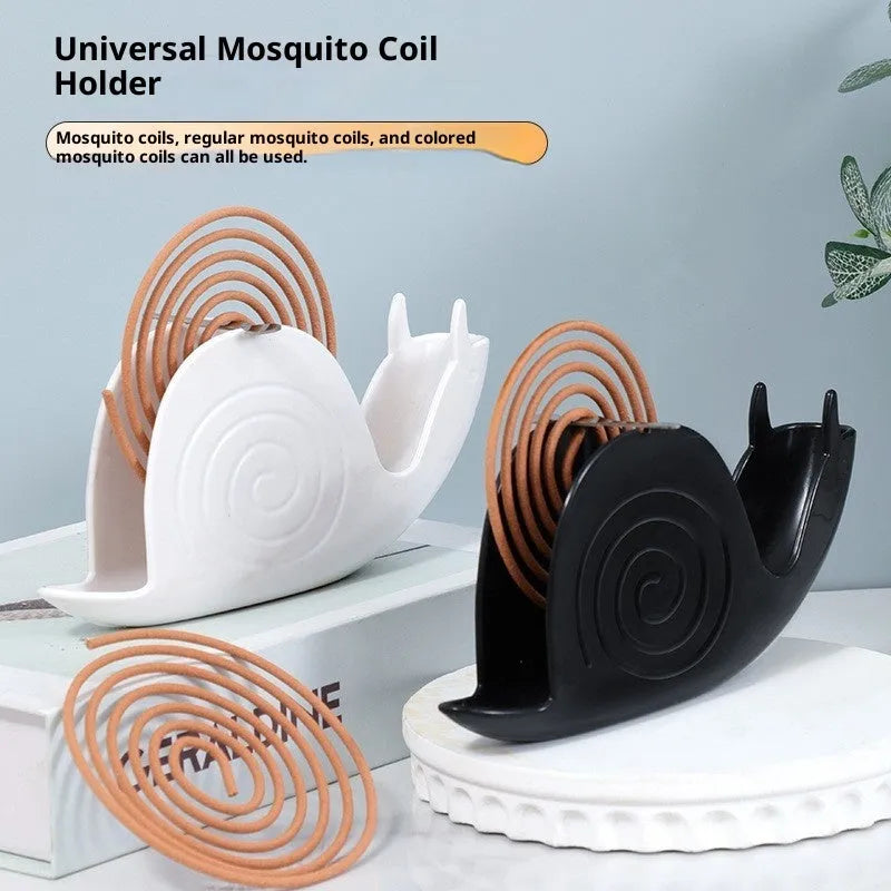 Plastic mosquito incense holder in black creative animal style on a table