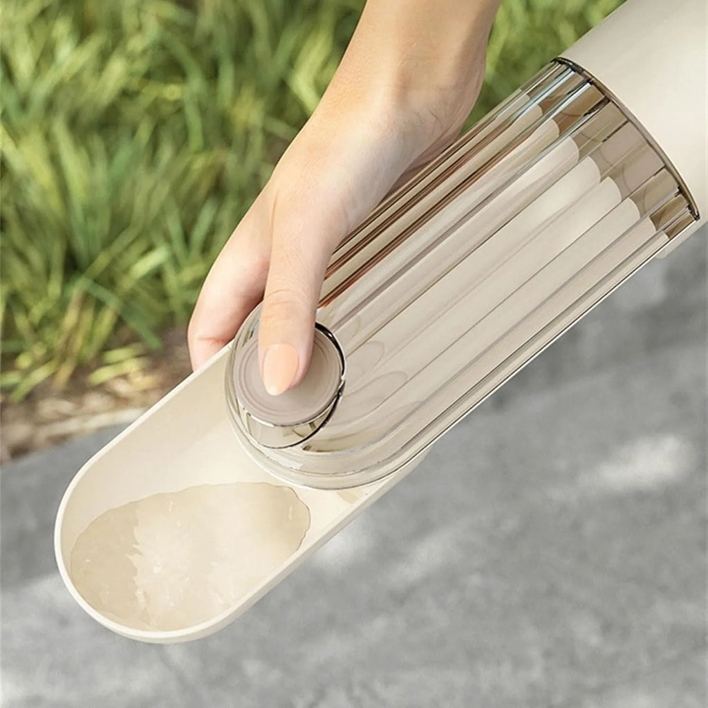 Beige and green foldable dog water bottle with food container, 21.5cm tall with leak-proof design