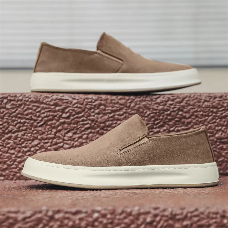 Men's casual shoes in solid grey colour with round toe, mid heel, and sewing line detail
