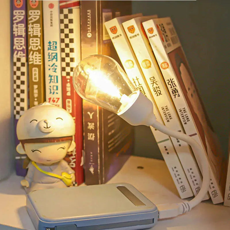 Folding USB rechargeable night light with tungsten filament bulb in warm white illumination