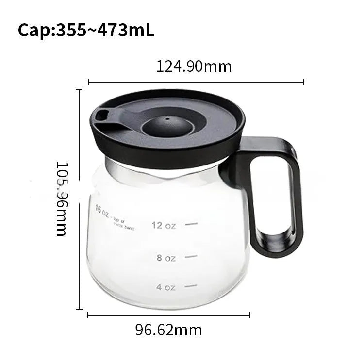 Transparent borosilicate glass coffee maker with a black silicone cover on a kitchen counter.