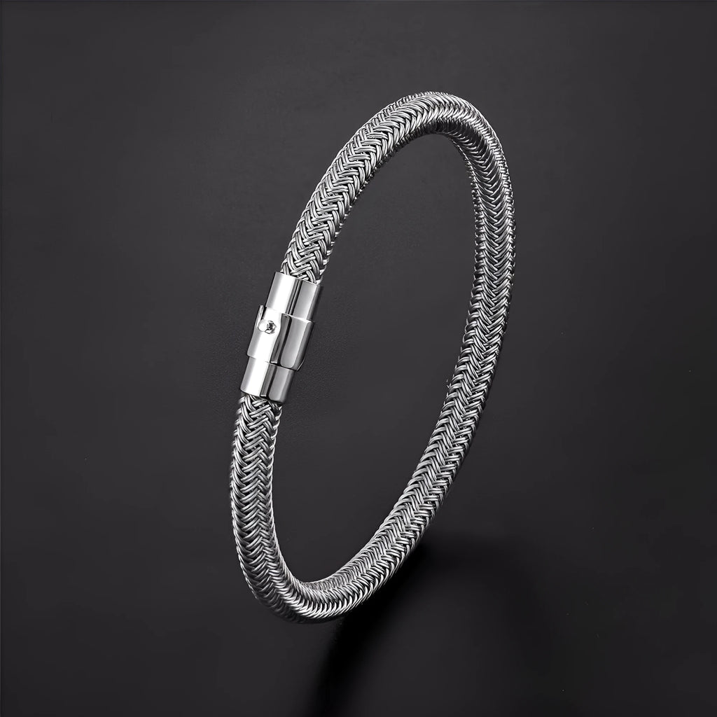 Geometric titanium steel bracelet with magnetic clasp shown in silver tone.