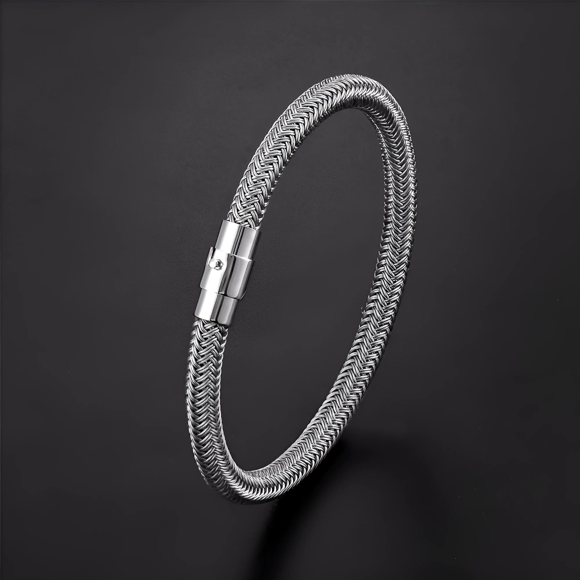 Geometric titanium steel bracelet with magnetic clasp shown in silver tone.