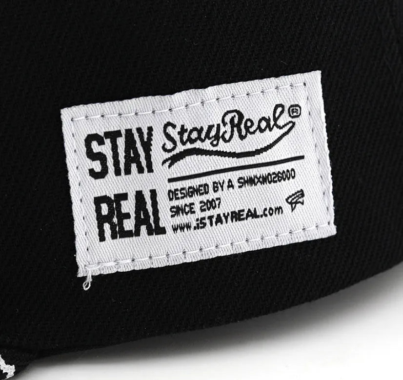 Cotton baseball cap with embroidered letters in black colour showing adjustable strap and dome crown