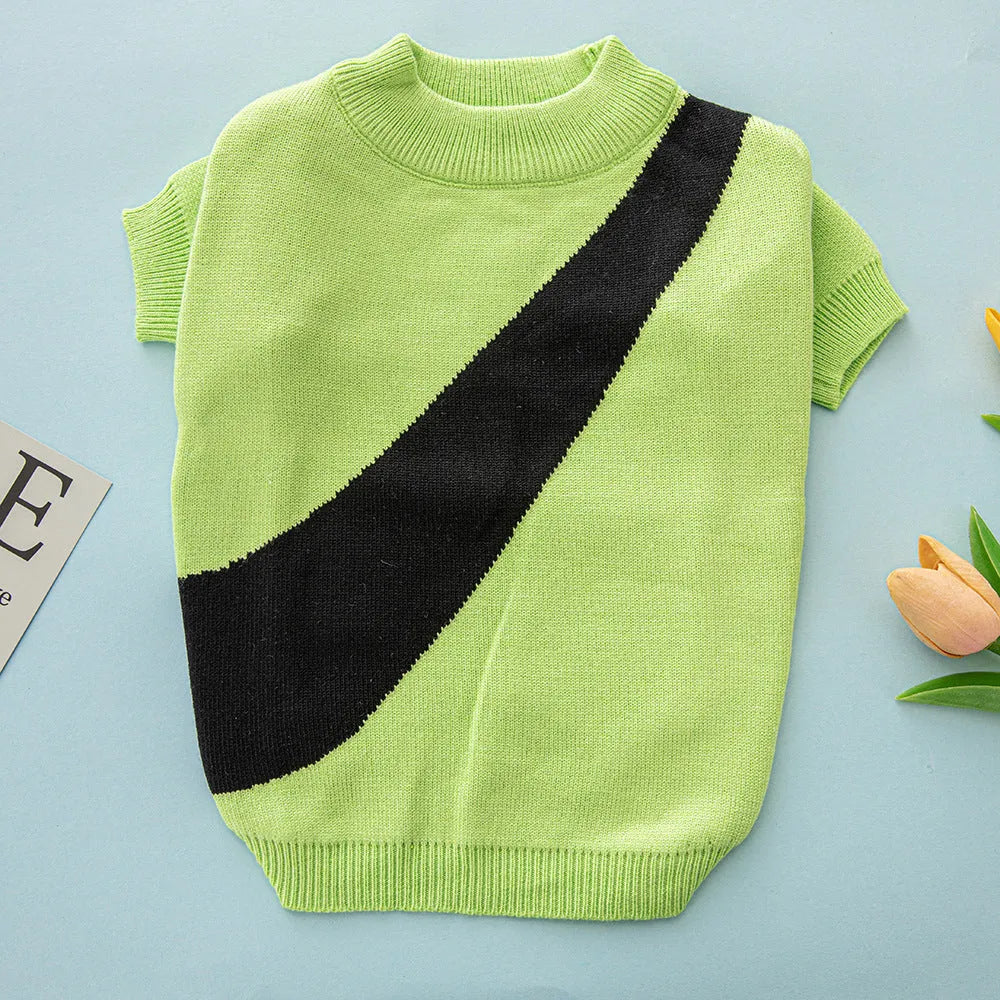 Wool knit sweater for a corgi or poodle dog on a hanger, showing colour options: black, orange red, pink, milky white, light green, sapphire blue.