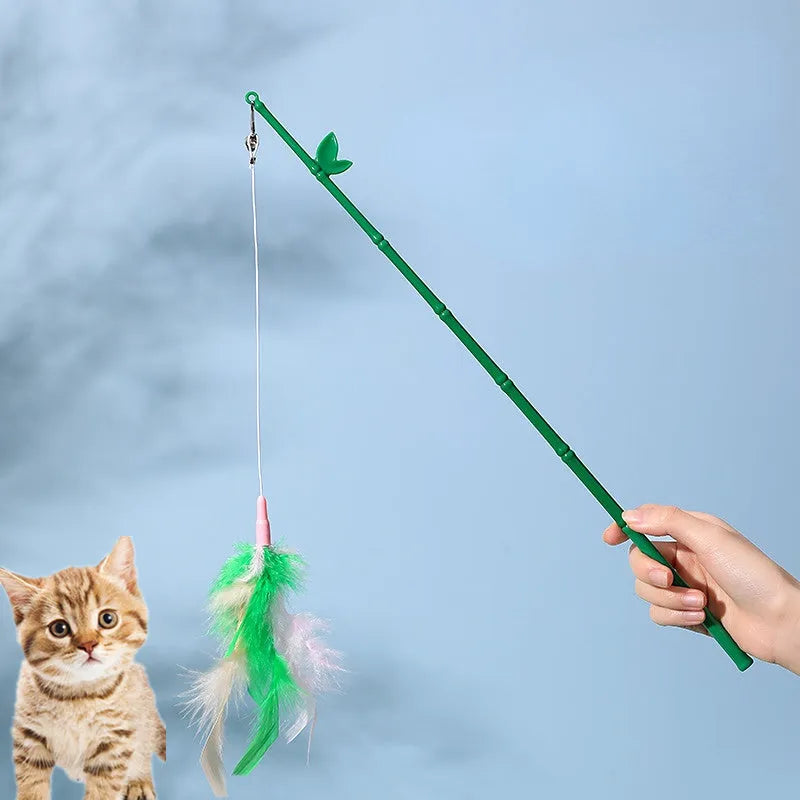 Interactive cat toy feather wand with green bells and feathers on a durable wand