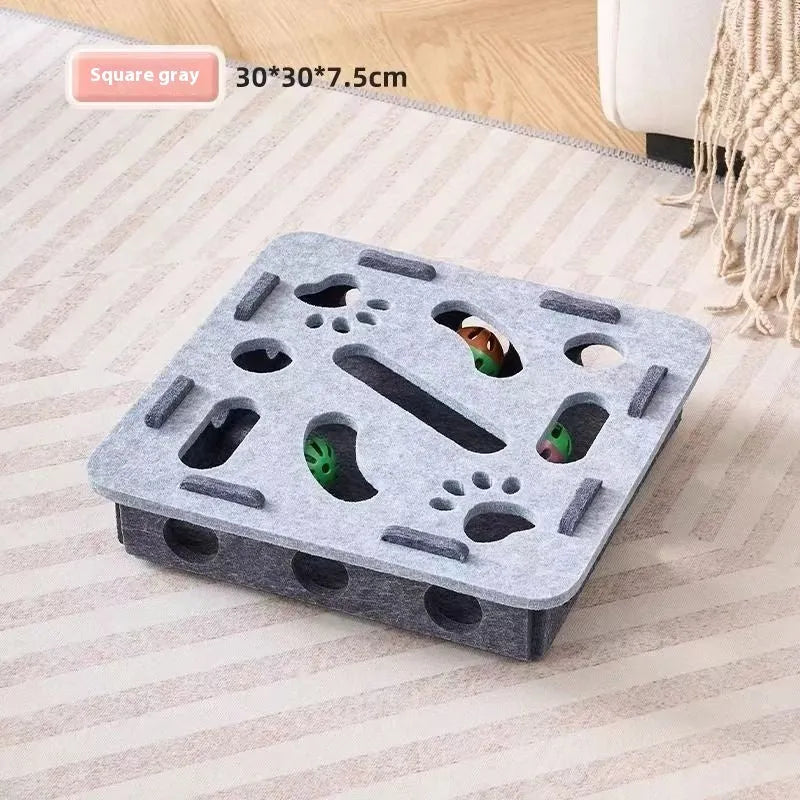 Square green brown felt cat scratching pad with a centre hole, dimensions 30x30x7.5 cm.