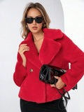 A rose red women's short loose faux fur coat with regular sleeves on a model.