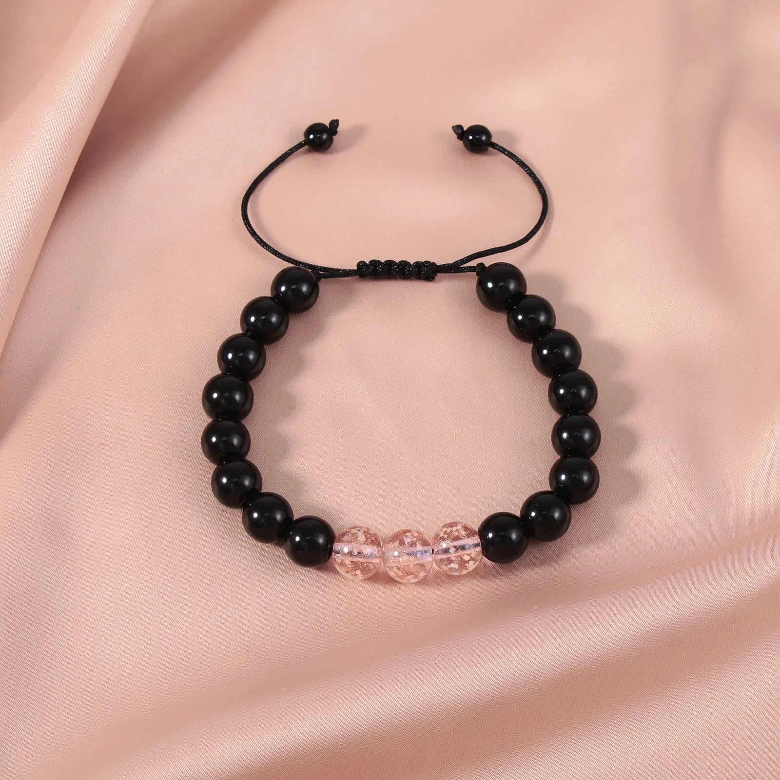 Beaded adjustable luminous bracelet in six colours: black, red, green, pink, blue, sapphire blue, glass or coloured glaze beads, geometric shape