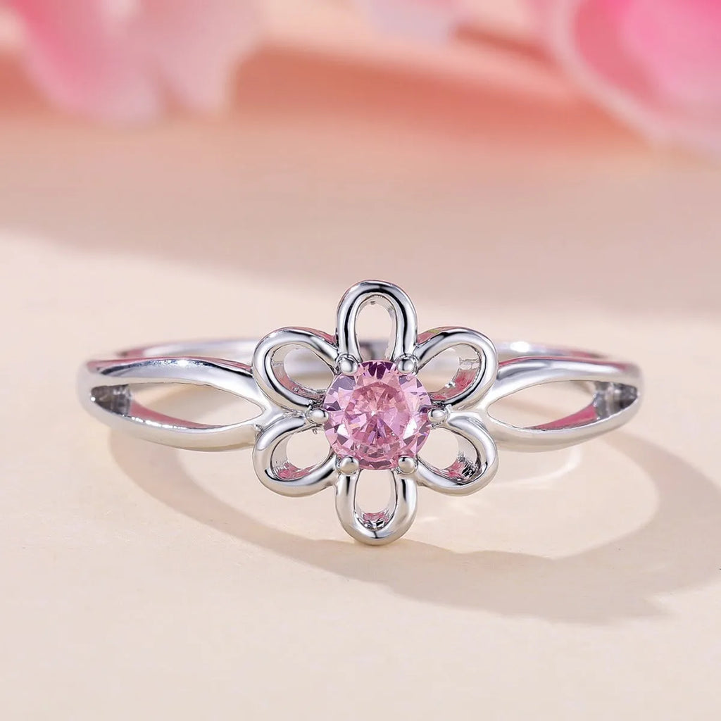Lady's flower hollowed fashion simple ring in copper with platinum pink diamond electroplated finish