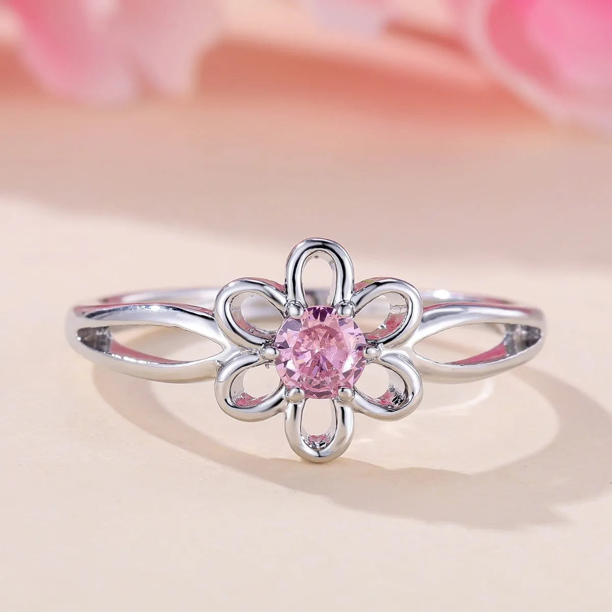 Lady's flower hollowed fashion simple ring in copper with platinum pink diamond electroplated finish