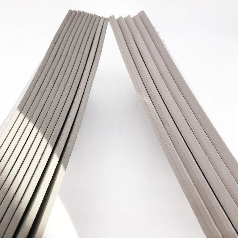 Black and grey plastic light-sensitive seal mat for pottery and calligraphy, 330mm by 110mm.