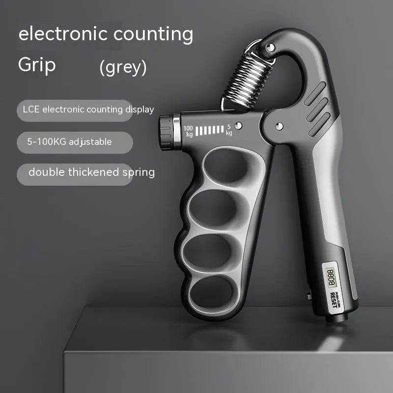 Orange electronic counter spring grip trainer held in a hand.