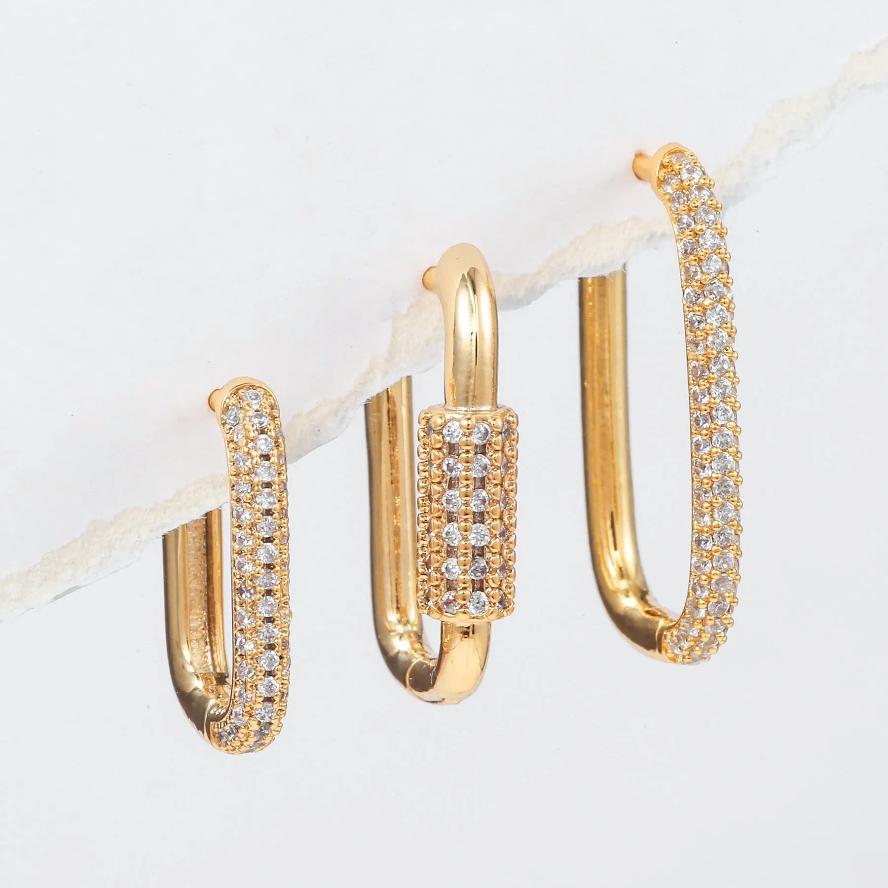 Three geometric ear clips with square design and micro inlaid zircon detailing in gold or white colour options