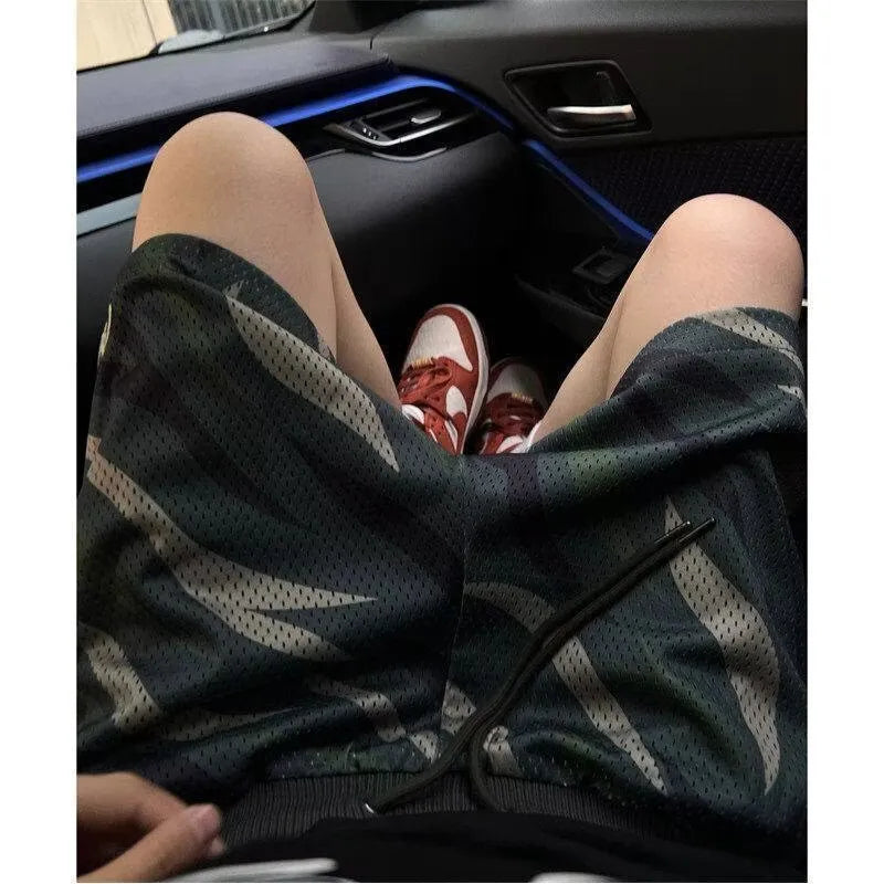 Men's straight-leg camouflage mesh shorts in cotton blend fabric showing size options