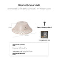 Beige and grey wine bottle shaped camping lantern with USB-C port showing three light mode options