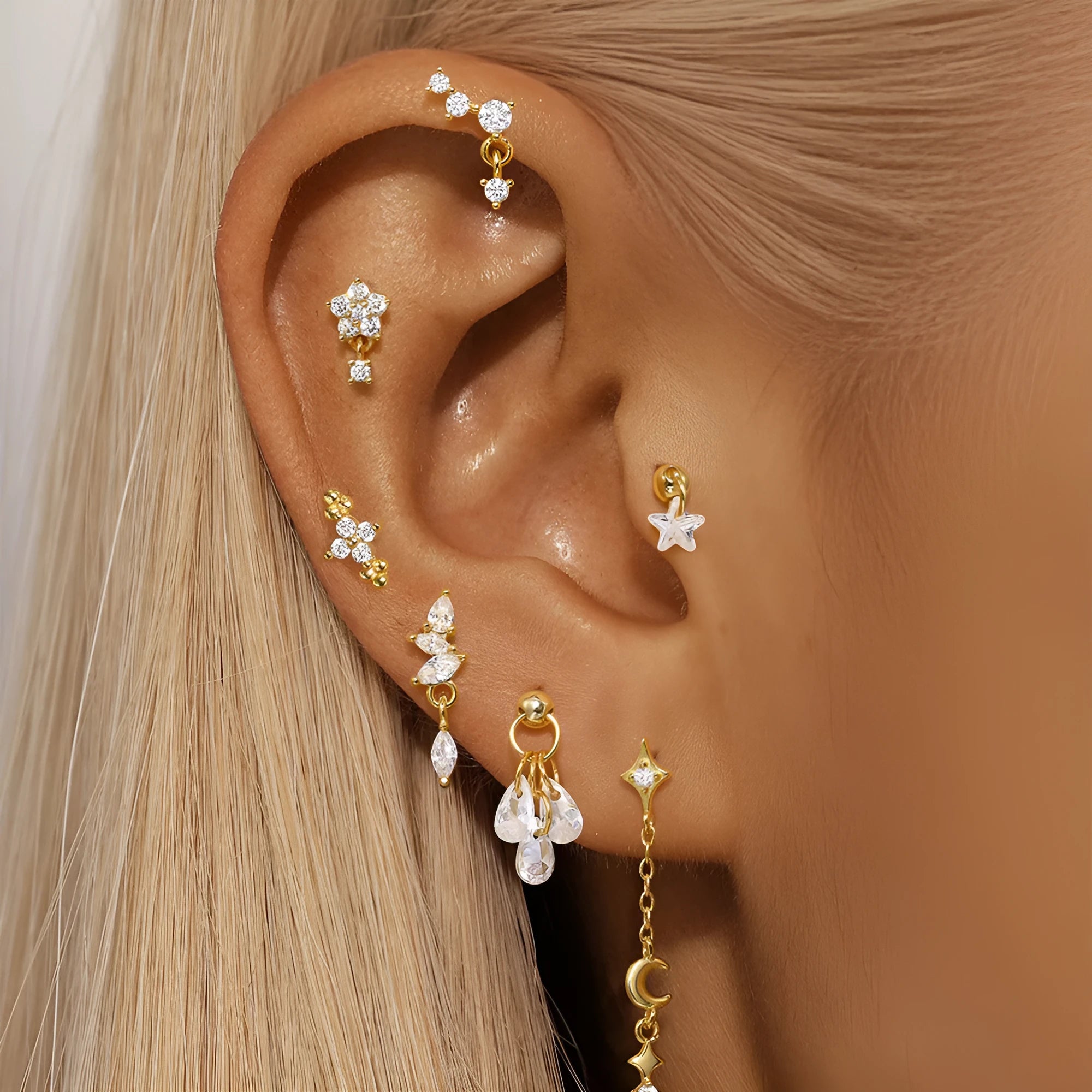 S925 sterling silver geometric earrings with moon and diamond-embedded star design in a gold colour.