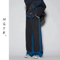 Youth fashion distressed denim suit set showing sleeveless vest and matching jeans with colour gradient finish