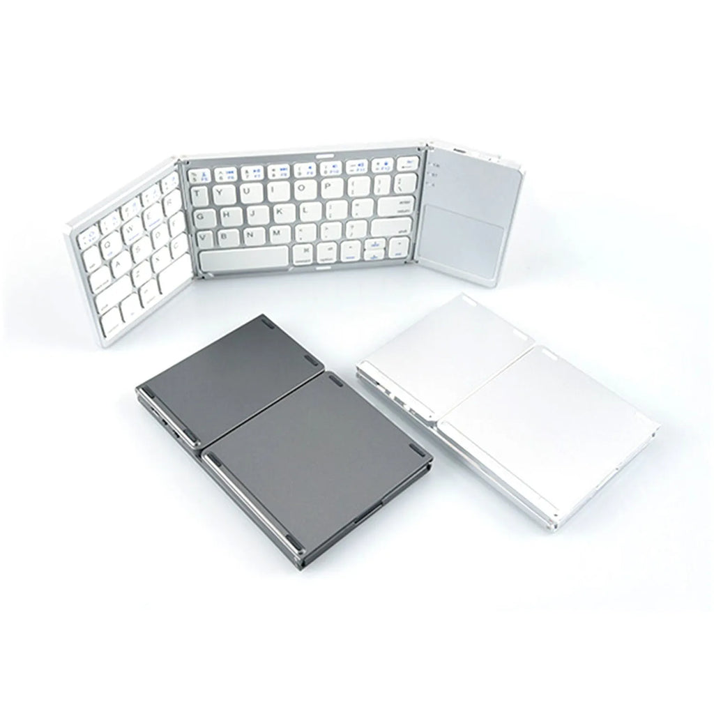 Mini tri-fold aluminium Bluetooth keyboard shown folded to 30.2cm length beside smartphone