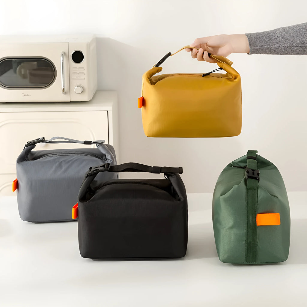 Japanese style insulated lunch bag in Oxford cloth, shown in one of four colours.