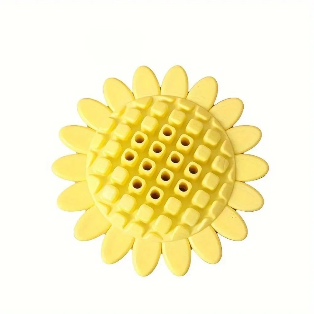 Yellow rubber sunflower dog toy for teething puppies on a light background