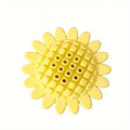 Yellow rubber sunflower dog toy for teething puppies on a light background