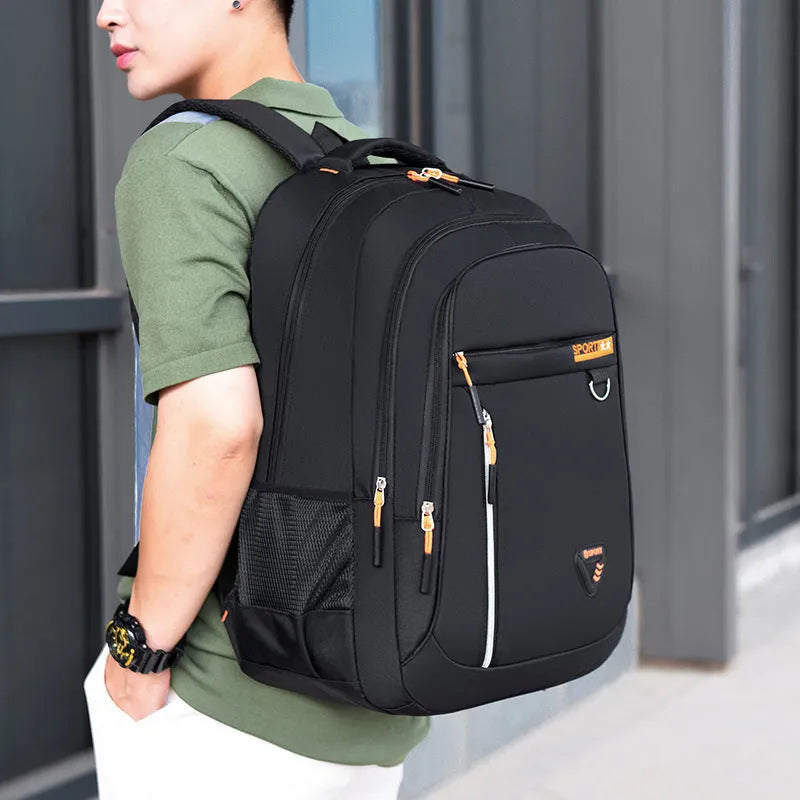 Men's Oxford cloth schoolbag in black showing spliced pattern design and air pillow belt system