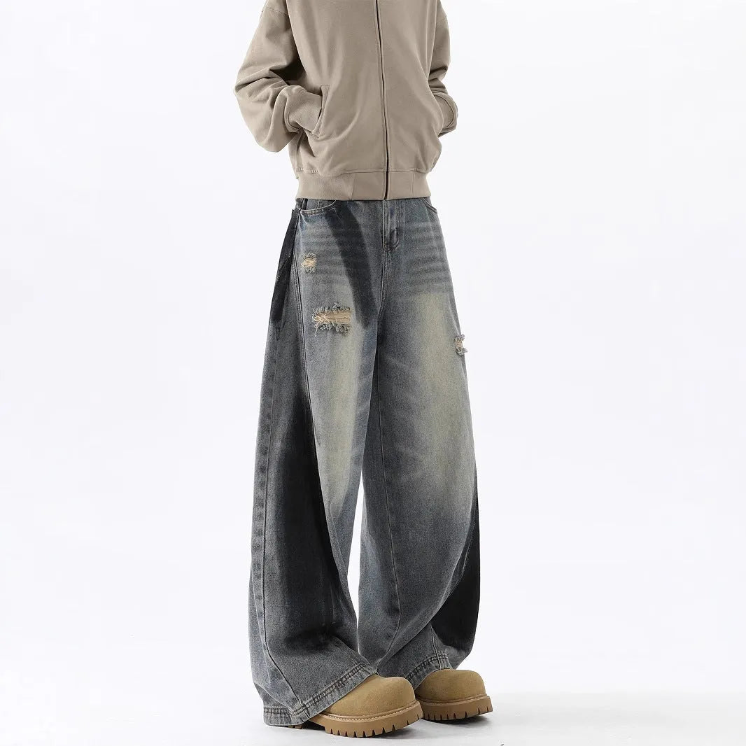 Men's blue American-style splash-ink ripped machete cotton jeans with micro elasticity