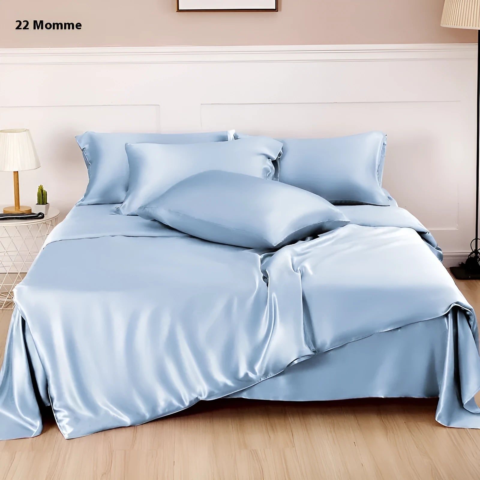 Solid colour silk duvet cover in Lotus Pink showing plain weave texture on a bed.