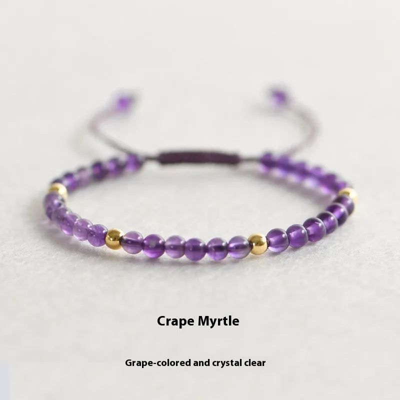 Handmade 4mm natural amethyst bracelet with 14K gold plated accents on a white background